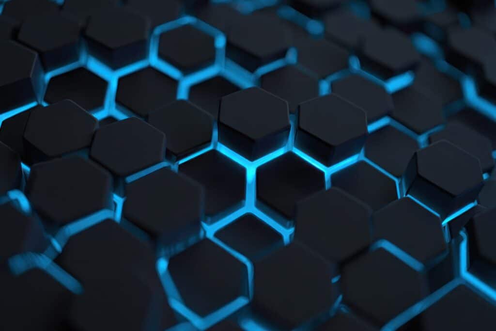 Close-up of dark hexagonal shapes with glowing blue edges creating a futuristic geometric pattern AdobeStock 1519418203 scaled 1